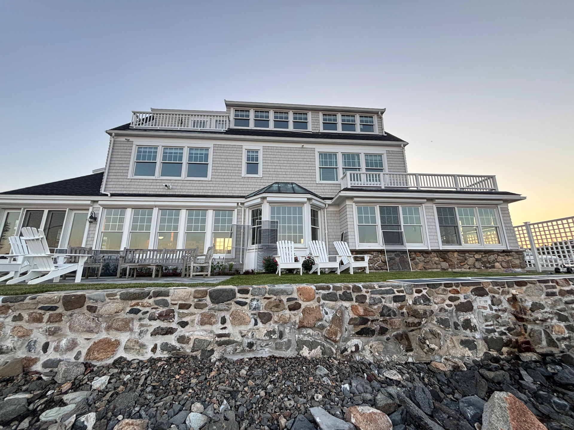 Beautiful coastal Maine home with pristine windows at sunset